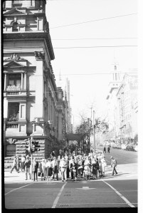 Pedestrians waiting at traffic lights corner of Swanston and Collins Streets, Melbourne [Mark Strizic, photographer] ca.1950-ca.1980, State Library of Victoria